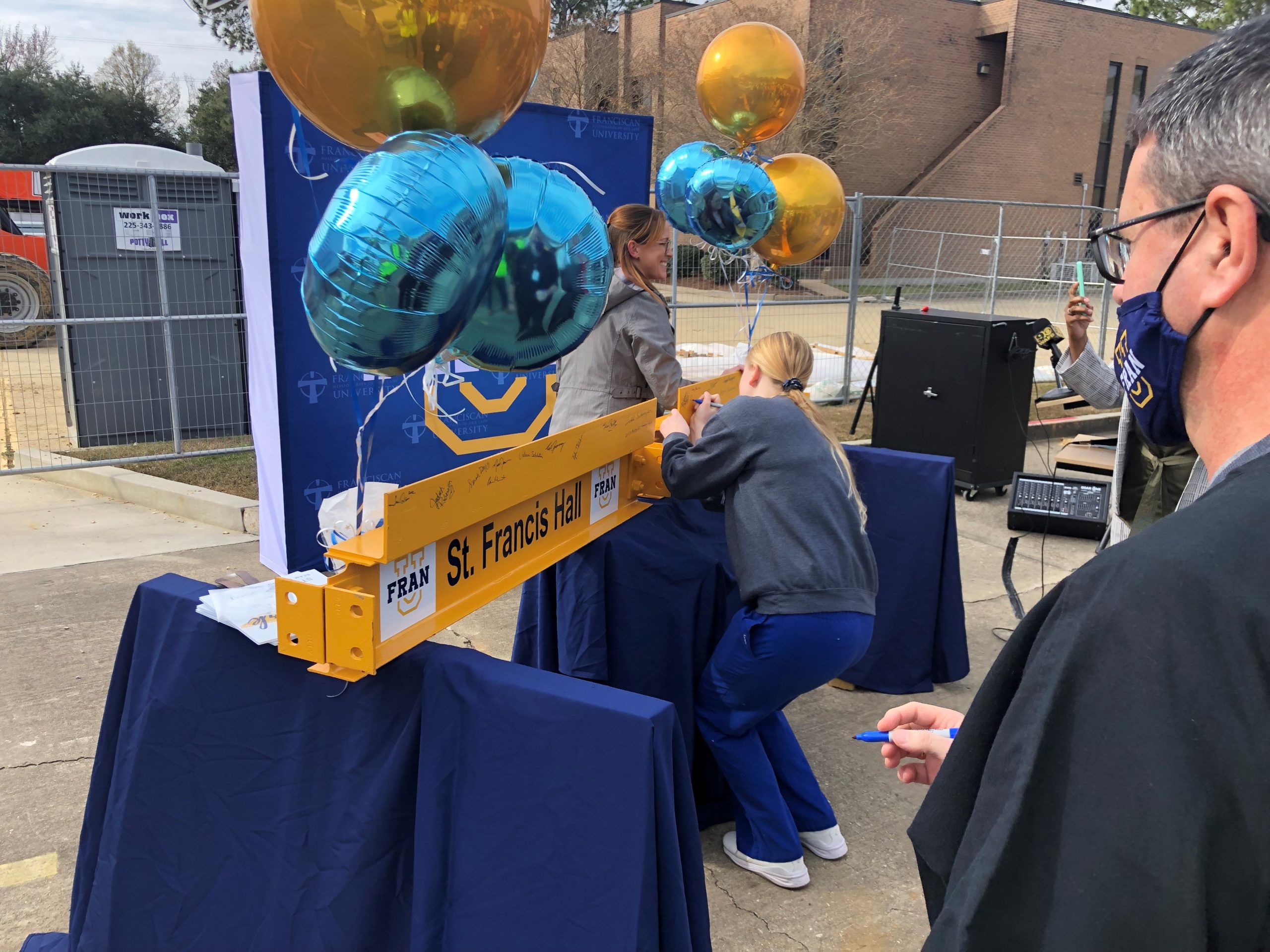 “Beam Signing” Ceremony marks Construction Progress on the new Fran U Project